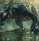 A Baryonyx standing on the edge of a riverbank